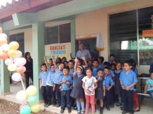 Wayne Waite with children at the Good Shepherd Bilingual School