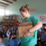Distributing toothbrushes  at the bilingual school