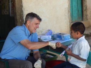 Dr. Tommy Ball fistpumping young patient