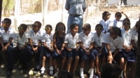 The local students with their new shades after learning about sun protection